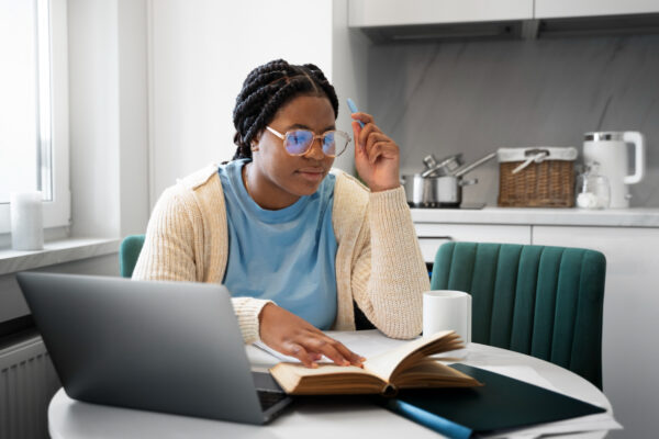 medium-shot-woman-with-laptop-home