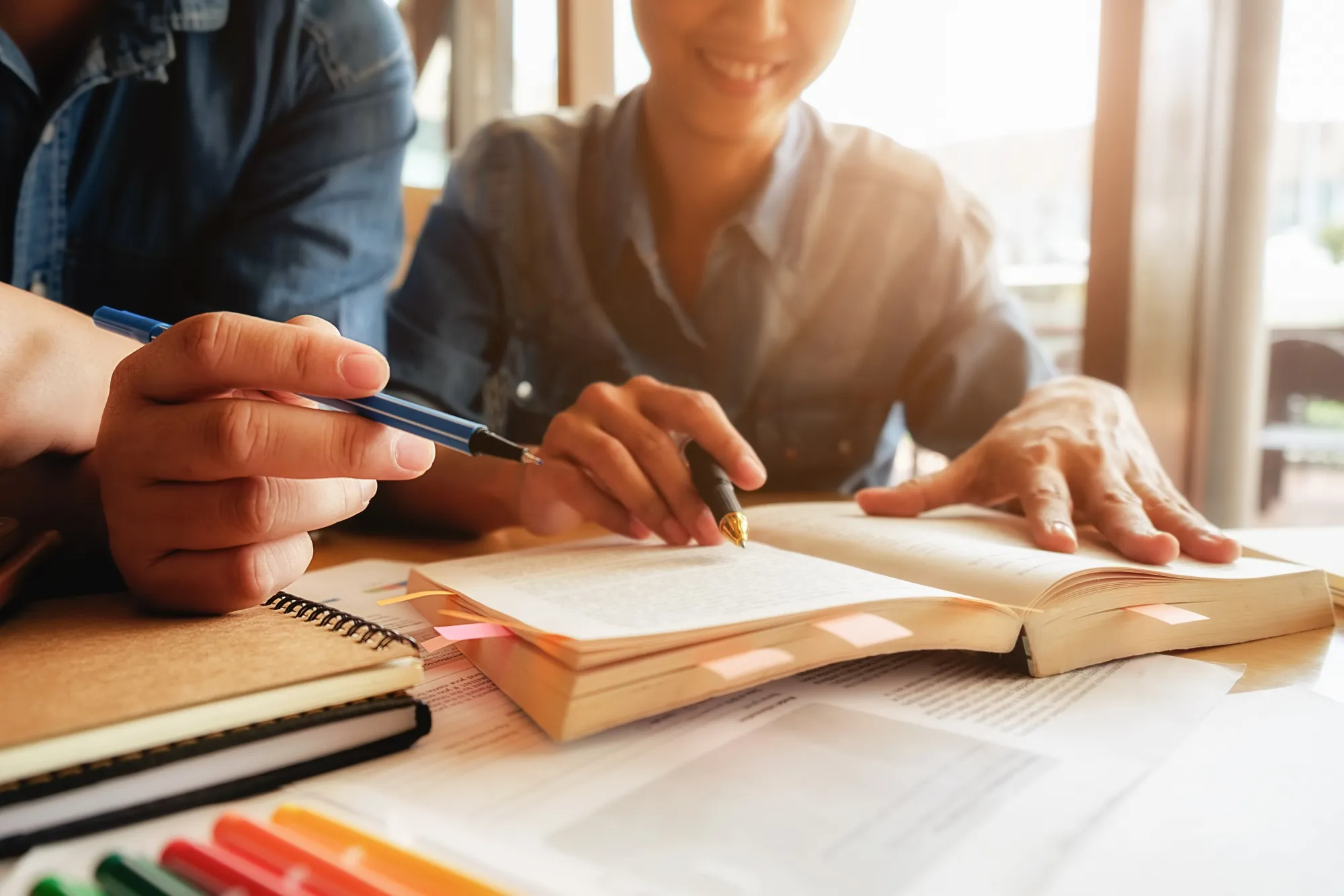 Student studying with a well-organized revision timetable